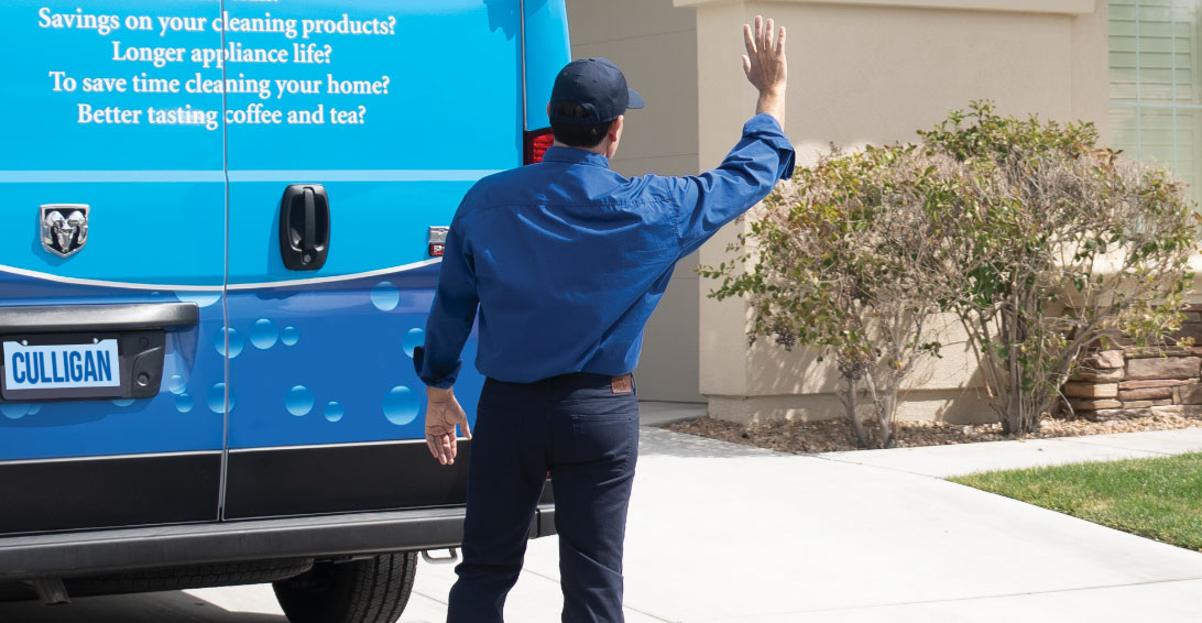Culligan Water expert waving from their van